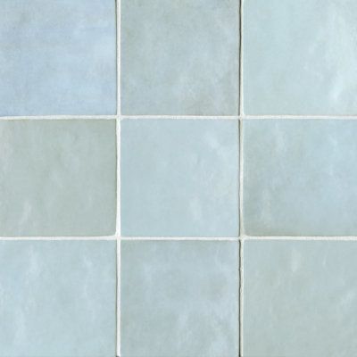 The Inspiration — the Leading Lady of the bathroom; square tile that looks handcrafted, in varying shades of blue.