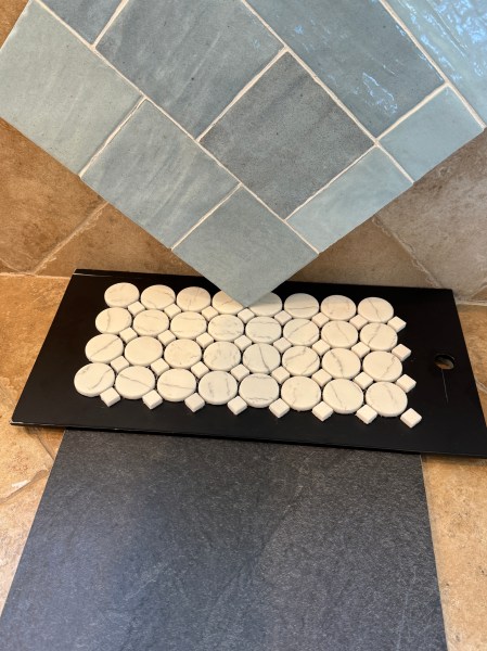The Selections! — Eureka! Square handcrafted-looking tile in hues of blue, a graphite slate-like floor tile, and a penny tile with diamond accents for the shower floor.